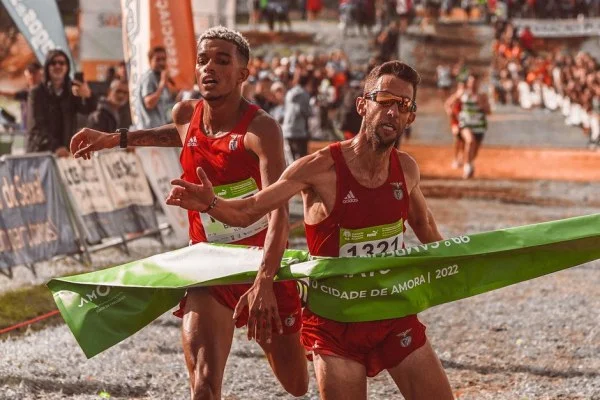 athlete crossing finish line